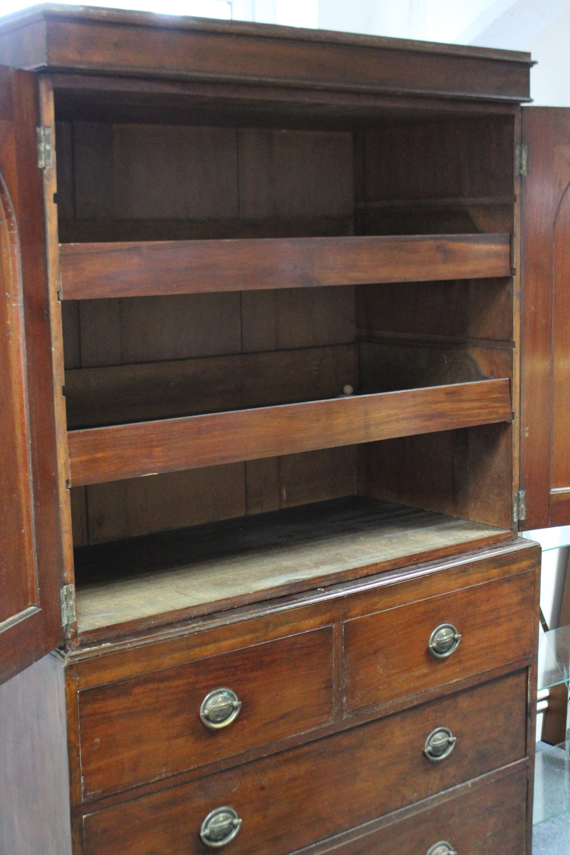 A 19TH CENTURY MAHOGANY LINEN PRESS the upper part fitted two sliding trays enclosed by pair of - Image 3 of 3