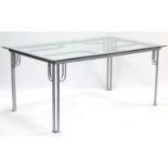 A silvered-metal conservatory table on stylised square legs & with tempered-glass rectangular top,