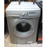 A John Lewis washing machine, in silvered-finish case.