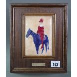 An enamelled rectangular plaque depicting a jester seated on a horse, 5¼” x 3¾” in hardwood frame.