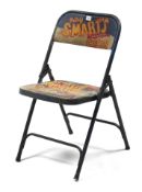 A modern painted-metal fold-away chair “Billy Smarts Circus”.