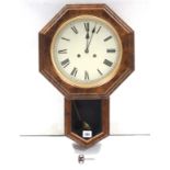 A Victorian-style drop-dial wall clock in oak-finish case, 20½” high