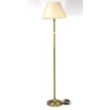 A brass standard lamp with shade; a floor-standing fan; & various decorative ornaments.