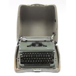 An Olympia portable typewriter, with case.