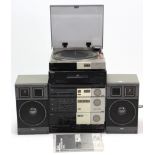 An Akai stacking hi-fi system; & a Technics c.d. player.