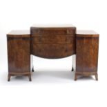 A mid-20th century burr-walnut aesthetic-style dressing table fitted three long drawers to centre