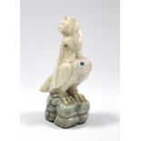 An alabaster parakeet ornament with glass bead eyes, 15¼” high.