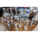 Five glass decanters; two glass celery vases; & various drinking glasses.