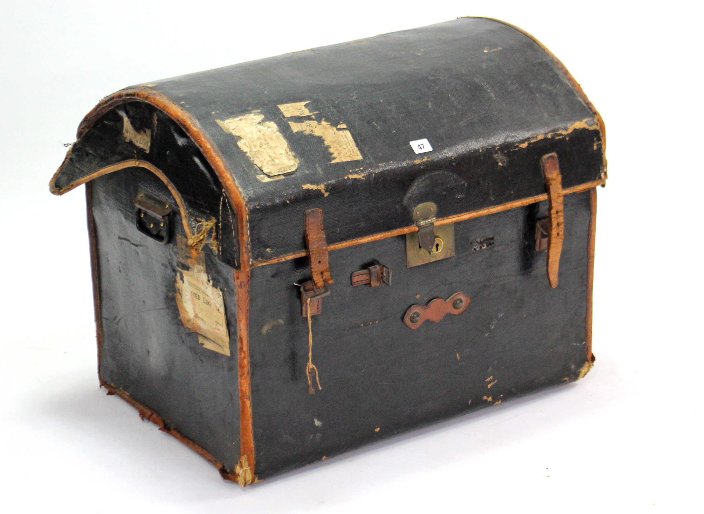 A late 19th/early 20th century black fibre-covered & leather-bound domed-top travelling trunk with