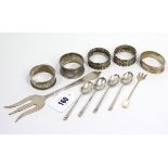 A George V silver serving fork, 7¼” long, Chester 1931; five various silver napkin rings; four