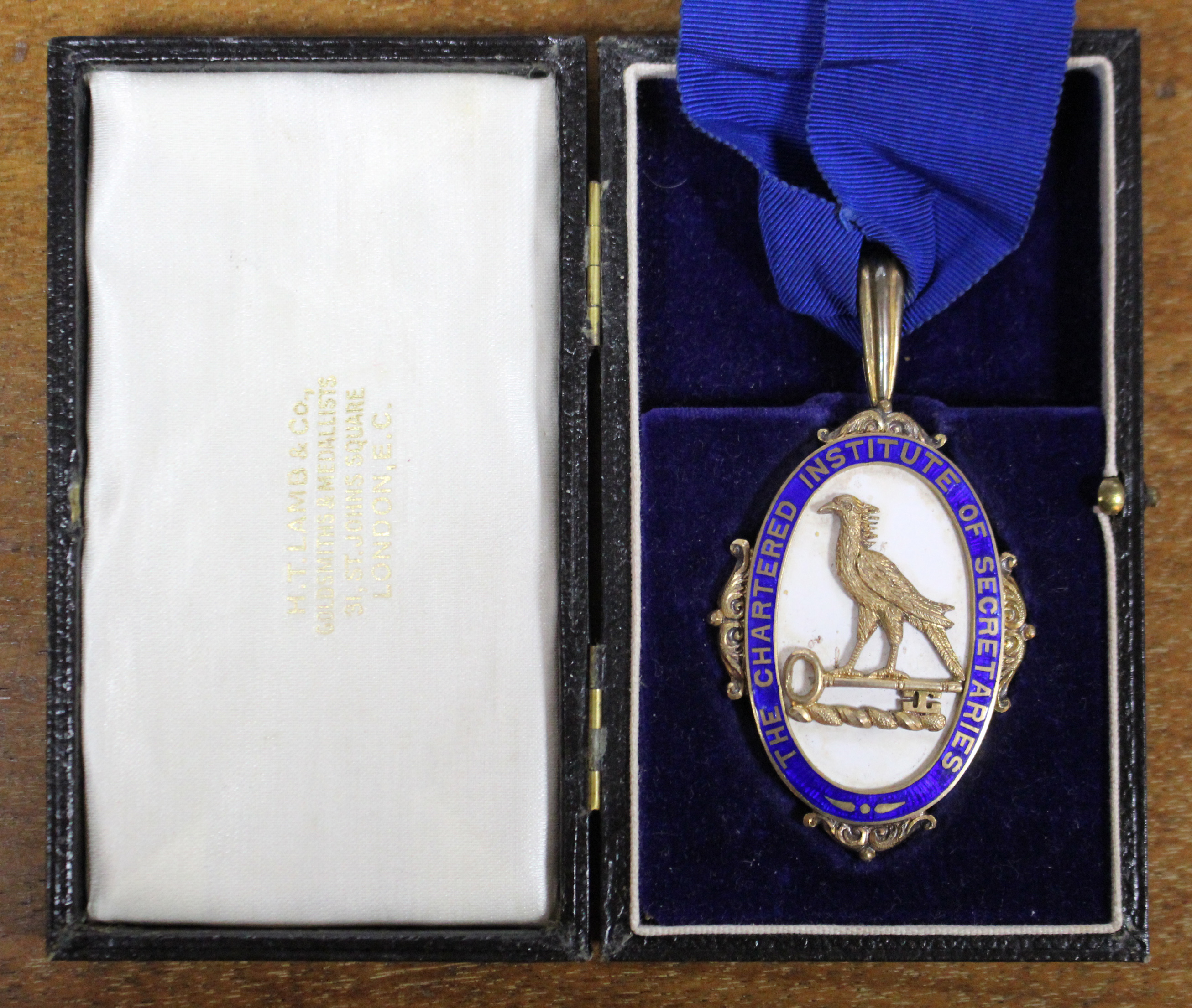 The President’s badge of the Chartered Institute of Secretaries in silver-gilt & enamel, the reverse