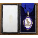 The President’s badge of the Chartered Institute of Secretaries in silver-gilt & enamel, the reverse