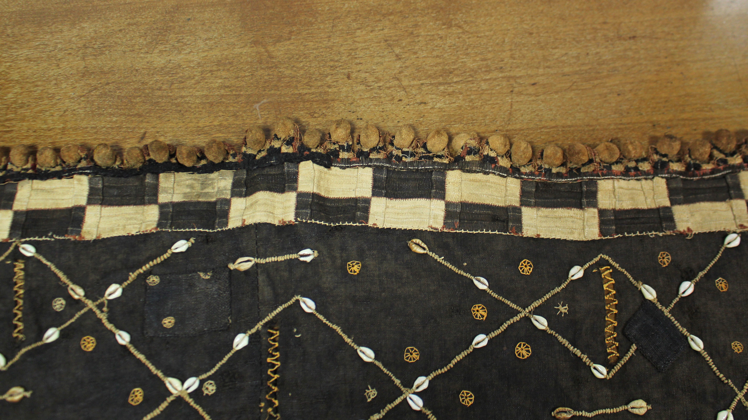 A Kuba cloth panel, the dark brown field with decorative trellis-pattern stitching & applied small - Image 4 of 7