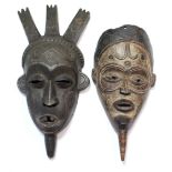 A tribal mask, possibly Biombo, the head with three carved crests, 16”; & another, possibly Lulua,