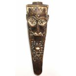 A large Kuba Kete mask with painted decoration in white pigment, protruding eyes in deeply carved