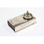 A late Victorian silver rectangular sealing wax box with miniature taperstick, & on four ball