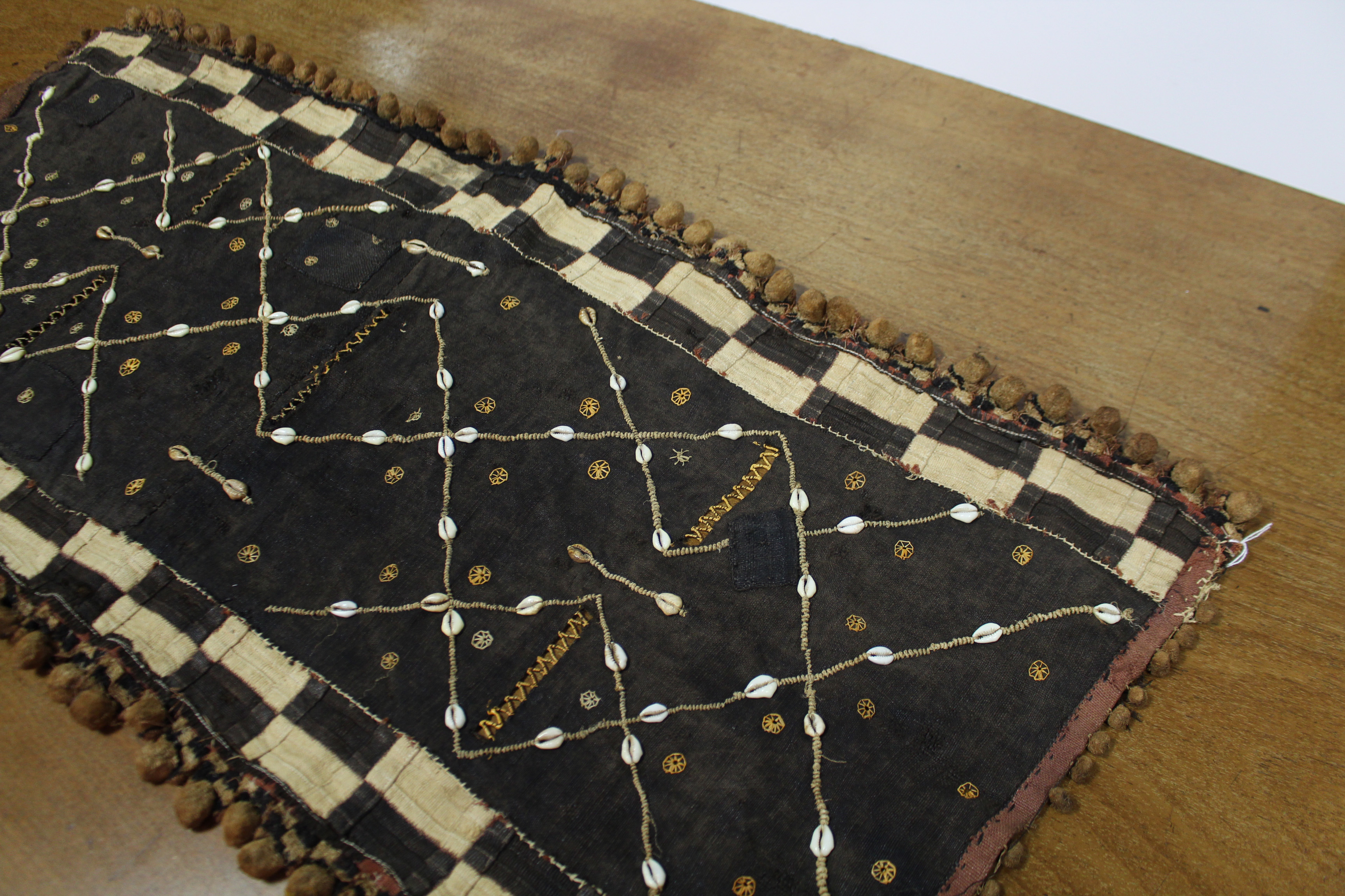 A Kuba cloth panel, the dark brown field with decorative trellis-pattern stitching & applied small - Image 3 of 7