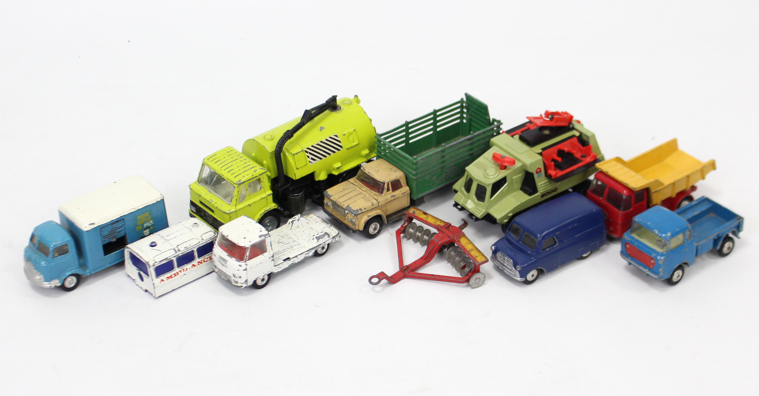 Nine various die-cast scale models by Corgi, Dinky, etc., all un-boxed.