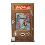 AN EARLY/MID 20th CENTURY “EASY PERM” PENNY-IN-THE-SLOT/FLICK-BALL ARCADE MACHINE, in oak case,