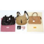 A Paul Costelloe tan leather ladies’ handbag; & two Radley ladies’ handbags.