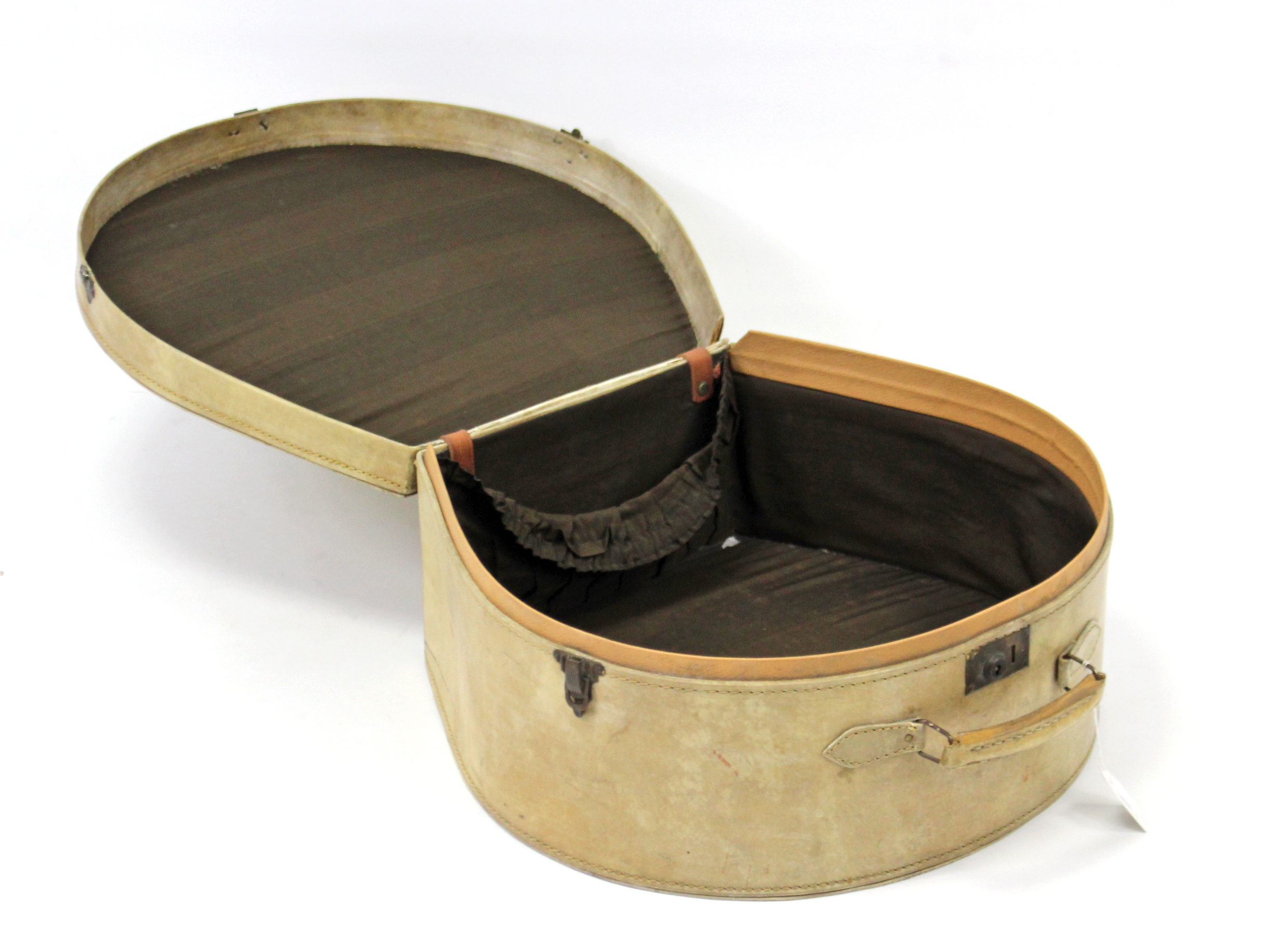 A French mid-20th century leatherette hat box, bears label “Hallduvoyage 18 Rue Des Pyramides,