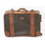 A Louis Vuitton (?) suitcase, fitted chrome twin-lever locks, 25” wide.