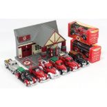 A “Texaco” model garage; & nine various “Texaco” scale model vehicles, boxed & un-boxed.