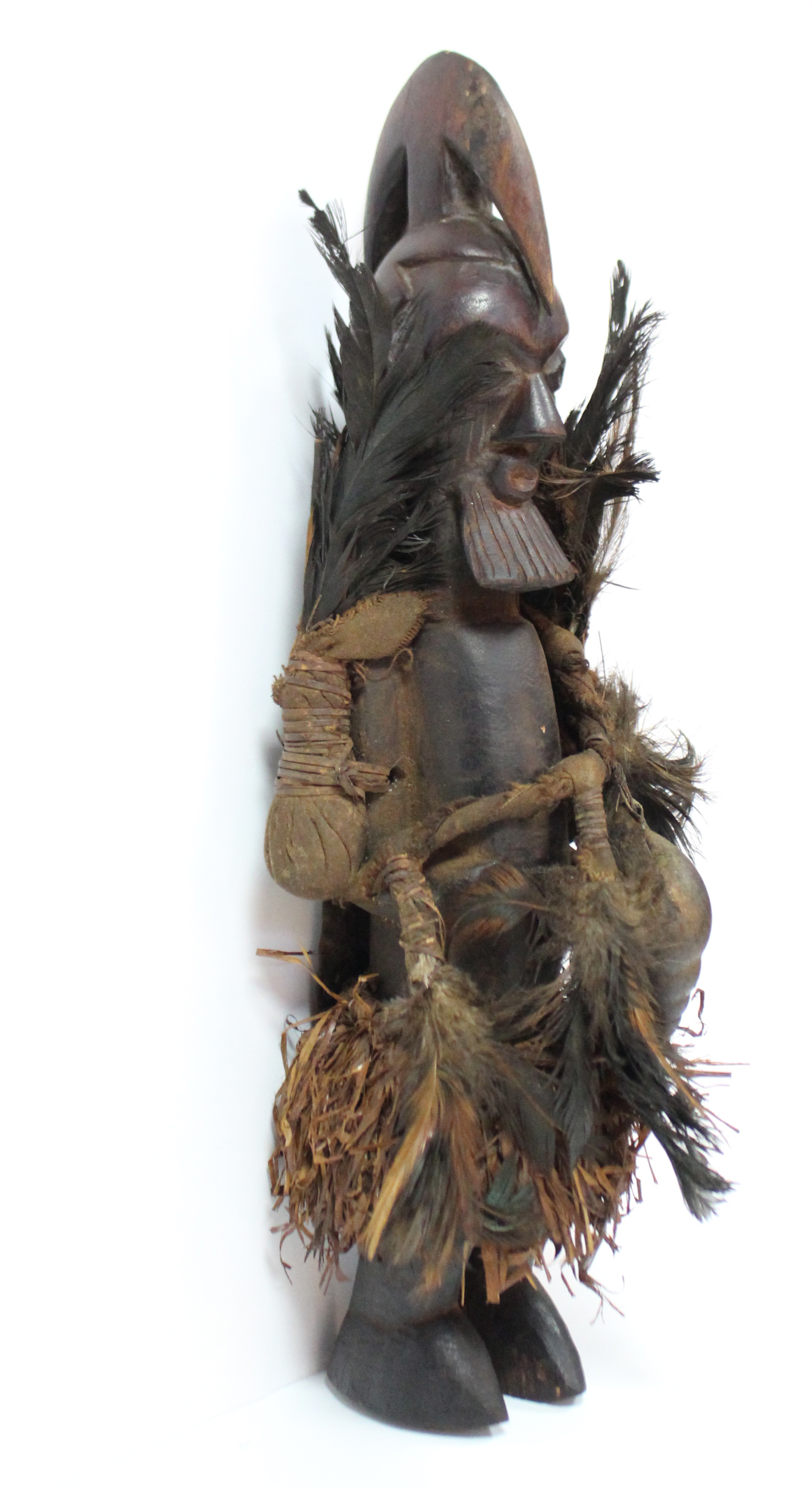 A Teke fetish figure with speer-shaped head-piece & scarified face, pouches of feathers either side, - Image 2 of 4