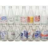 A collection of forty-two various glass advertising milk bottles.