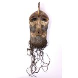A large Songye Kifwebe male mask with curved crest, square protruding mouth, the sides with deep