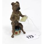 A Bergmann (Austria) cold-painted novelty ornament in the form of a character dog sat on a chamber