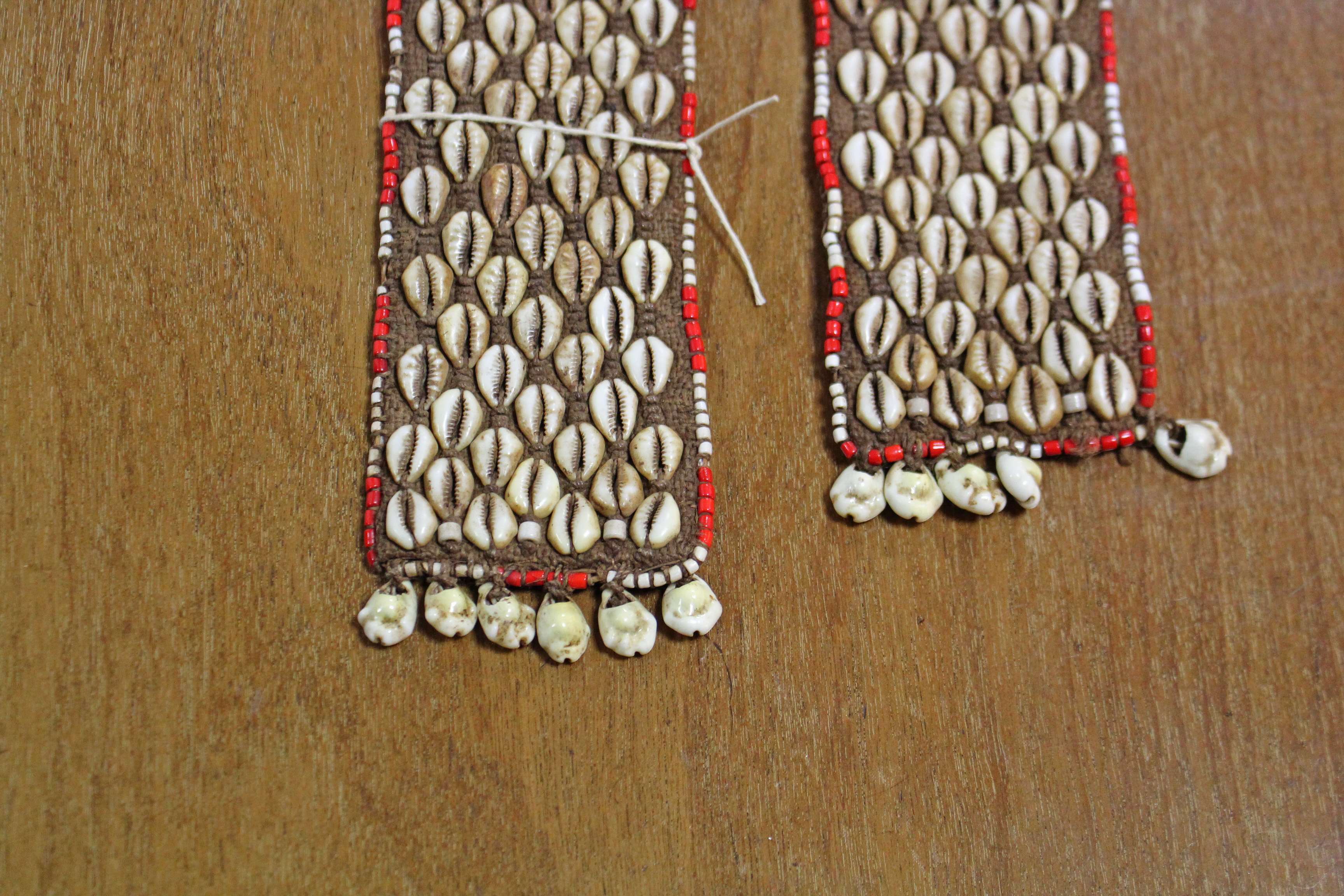 A Kuba woven raffia long belt with diagonal rows of applied cowrie shells either side of a central - Image 4 of 6