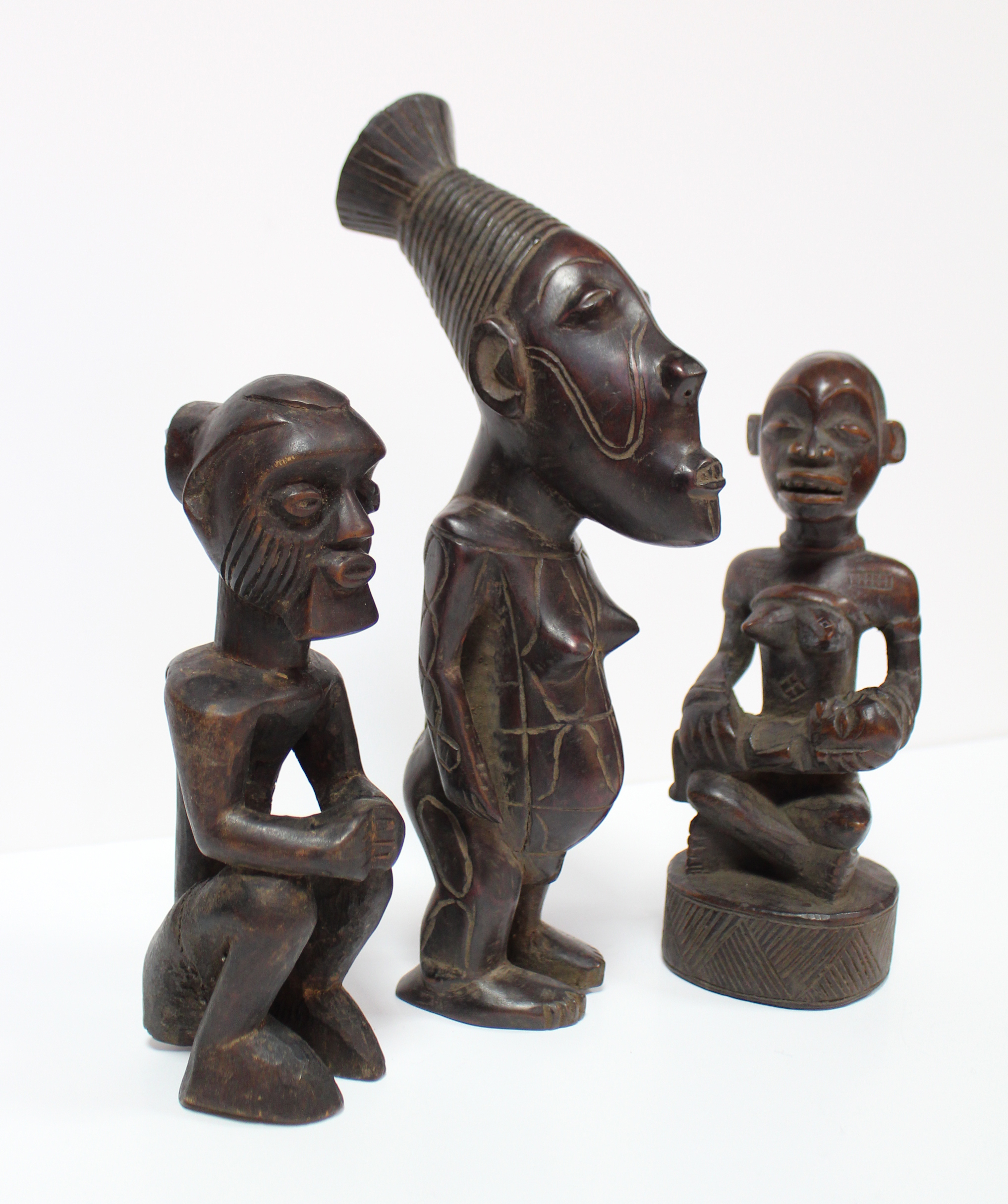 A Kongo carved wood maternity figure seated cross-legged, an infant on her lap, 8¼”; a similar - Image 2 of 4