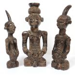 Three Lulua carved wood seated figures, two with pointed head-piece; 10” & 9” high; the third with a