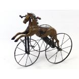 AN EDWARDIAN –STYLE PAINTED WOODEN & IRON CHILD’S “HORSE” TRICYCLE, 31” long x 28” high.