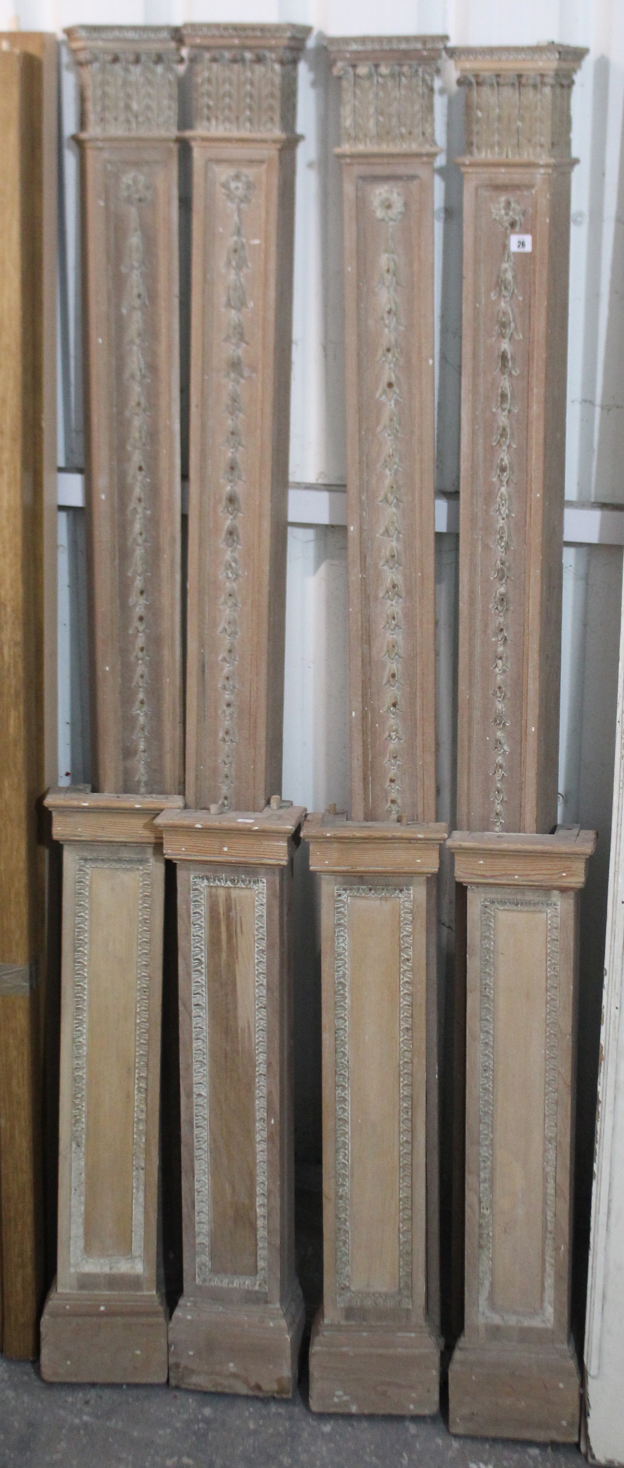 A set of four tall carved wooden ornate columns, 9’ 8” high (each column in two sections); & three