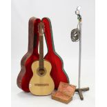 A Spanish six-string acoustic guitar, cased; & a microphone & stand.