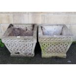 A pair of cast-stone garden planters of square tapered form, 15¾” wide x 13½” high.