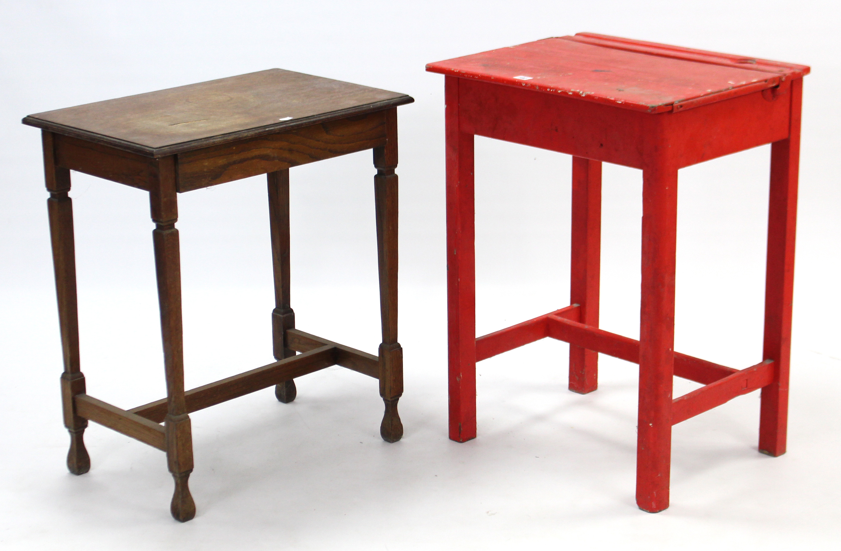 A red painted wooden child’s desk with hinged lift-lid, & on square legs with plain stretchers,