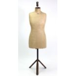 An early-mid 20th century dressmaker’s dummy on iron stand, 58” high.