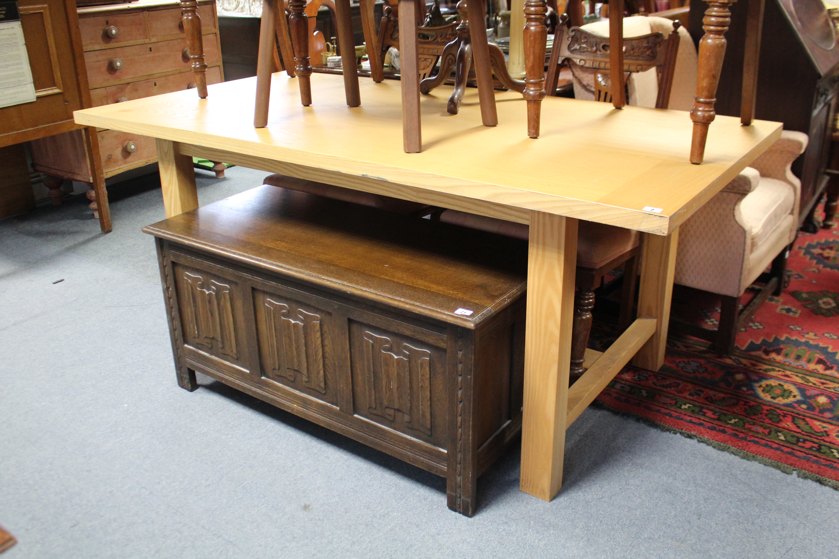 A pine kitchen table with rectangular top, & on square legs with plain stretchers, 71” x 35½”.