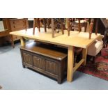 A pine kitchen table with rectangular top, & on square legs with plain stretchers, 71” x 35½”.
