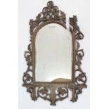 A carved wooden frame rectangular wall mirror inset bevelled plate, 47” x 29” (w.a.f.), together