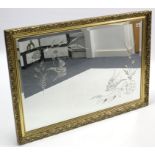 A large gilt frame rectangular wall mirror with bird & foliate design to the bevelled plate, 28” x