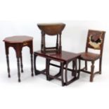 A mahogany nest of three rectangular occasional tables (two under one); an oak oval gate-leg