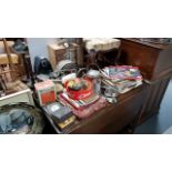 An oak cased mantel clock; a pair of oak candlesticks; a circular wall mirror; various decorative