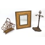 A rectangular wall mirror in floral painted frame, 25” x 22”; together with a cast-iron umbrella