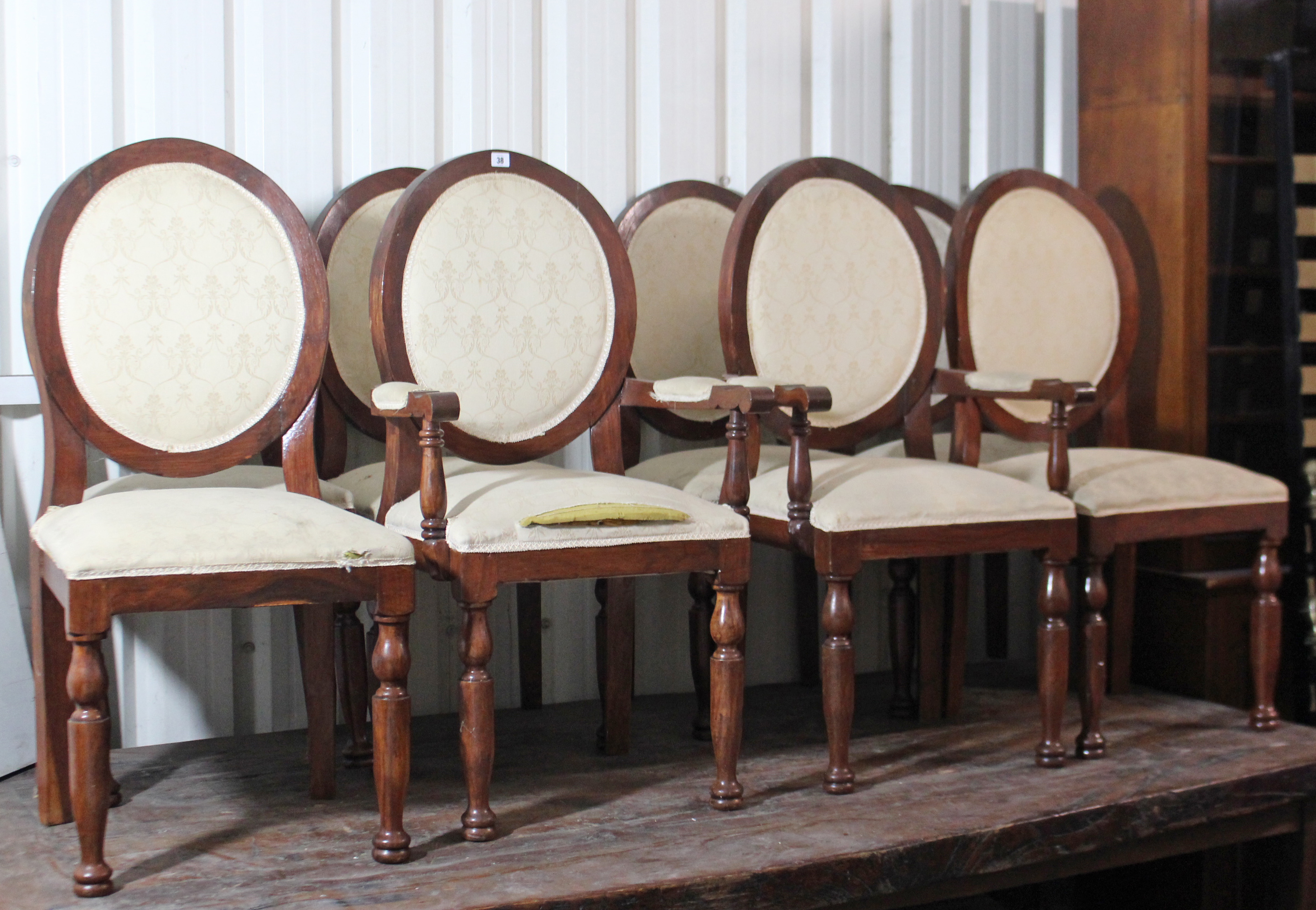 A set of eight Victorian-style balloon-back dining chairs (including a pair of carvers), with padded