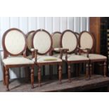 A set of eight Victorian-style balloon-back dining chairs (including a pair of carvers), with padded