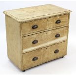 A Victorian grained pine dwarf chest fitted three long graduated drawers with cup handles, 31½” wide